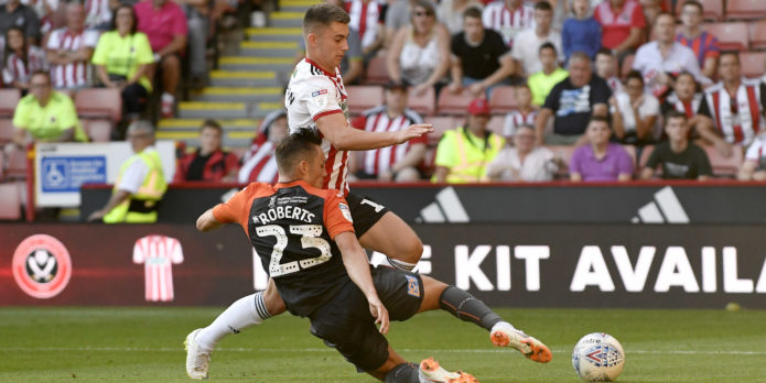 Wilder plays down talk of a Liverpool return for Woodburn
