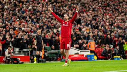 Szoboszlai fitness update: Dominik Szoboszlai in a Liverpool kit celebrating on the pitch at Anfield